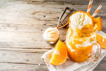 Orange Soda Creamsicle cocktail. Ice Cream and orange smoothie. Dreamsicle drink. Rustic wooden...