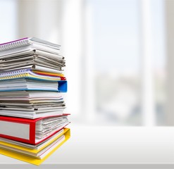 File folders with documents on white table