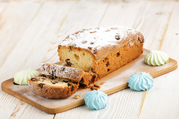 Delicious homemade cake with raisins on a light wooden background. close-up. rustic. copy space.