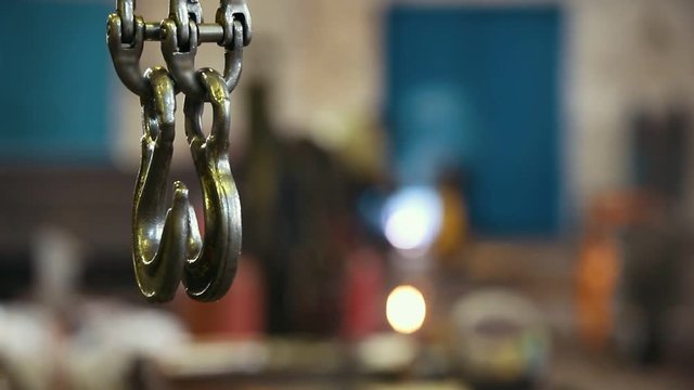 Industrial concept. An overview on construction site inside the manufacturing plate. A crane hook