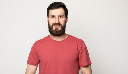 Fototapeta premium Portrait of cheerful smiling bearded man 