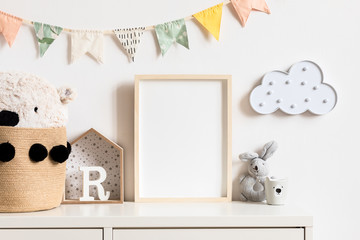 Stylish and modern scandinavian newborn baby interior with mock up photo or poster frame on the...