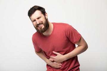 young man having a stomachache