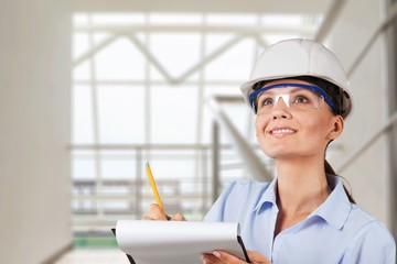 Portrait of young student of architecture  on background