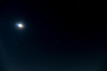 Background night sky with light of moon and moving of star.