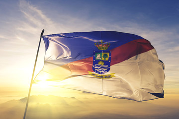 Concepcion department of Paraguay flag waving on the top sunrise mist fog