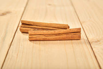 Cinnamon sticks isolated on a table wood