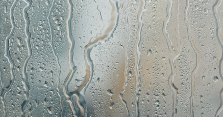 Water droplets on glass, rain outside