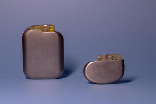 Two old pacemaker collection on a neutral background. Implantable devices in humans.