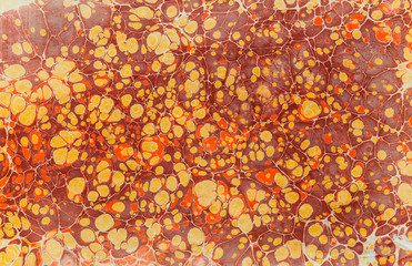 imprint ebru texture on paper brown yellow