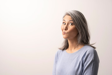 Mongolian Woman of Nationality is Thinking About Something.