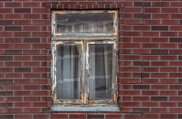 The window with curtain of an old farmhouse