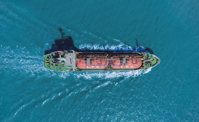 Aerial top view Ship tanker oil or Liquefied Petroleum Gas (LPG) full speed with beautiful wave transportation from refinery on the sea. - 255171633