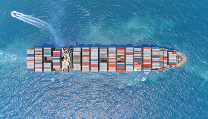 Aerial top view container ship on the sea full loadcontainer for logistics, import export, shipping or transportation.