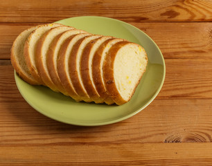 Slices of wheat bread on a plate .