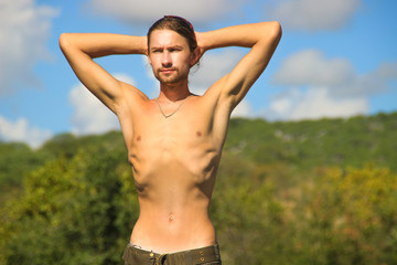 Very thin young white man with protruding ribs. Skin and bones.