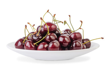 Heap of ripe cherries in bowl isolated on white background.