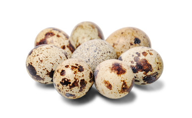 Group of quail eggs isolated on a white background. Close up. Selective focus.