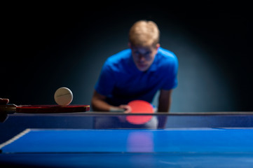 Portrait of young man playing tennis