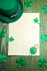 St. Patrick's Day. Leprechaun hat with empty blank and wax seal with shamrock