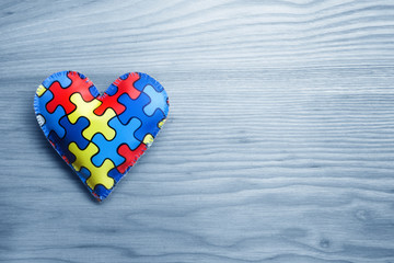 World Autism Awareness day, mental health care concept with puzzle or jigsaw pattern on heart