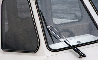 Obraz premium summer landscape on a mountain lake. fog over forest. ships and boats floating near the shore on the water