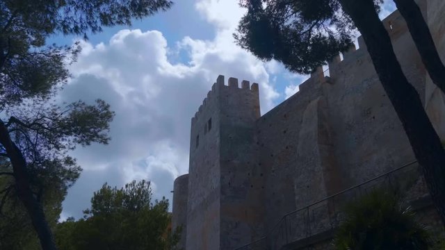 The ancient castle in the Spanish mountains is a national historical and cultural landmark, which is always visited by tourists. Shot in motion