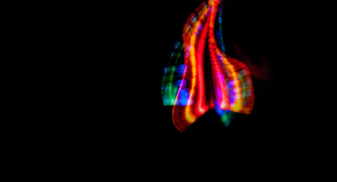 black background and light abstract patterns rainbow colorful, copy space, menu, freezelight drawing colored light