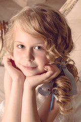 Little girl portrait blond with curls