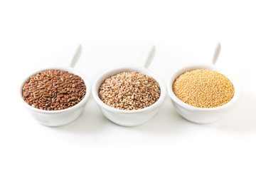 Healthy food ingredients 3 kind of gluten free grains Flax, Amaranth and sesame seeds on white background 