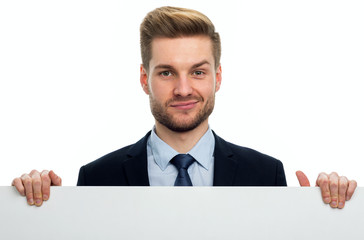 Business man holding white board