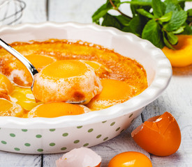 Peach Clafoutis in ceramic pie dish. Close up
