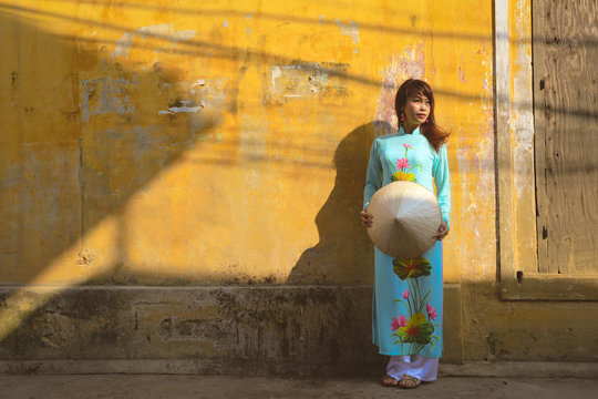 Beautiful vietnamese girl in traditional dress (ao dai). Ao dai is famous traditional costume for woman in VIetnam.
