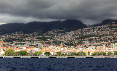 Fototapeta na wymiar mountain,trip,excursion,cruise,funchal,madeira,city,vacation,overcast,cloudscape,weather,clouds,ominous,atlantic,ocean,sea,water,architecture,coastline,background,beautiful,building,capital,cityscape,