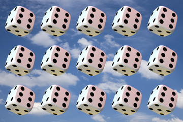 Close up of many playing dice, rotating on sky background.