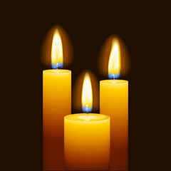 Set of three burning candles