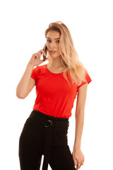 Beautiful young woman in red t shirt speak on a smart phone isolated over white background - phone chat