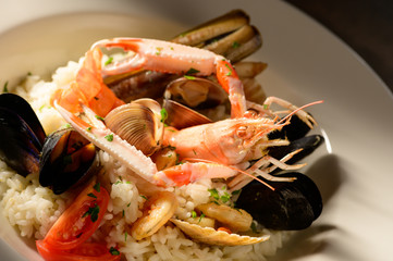 Rice with seafood on a plate in restauant ready to be served