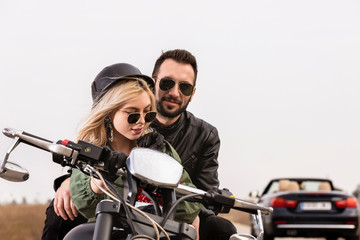Fototapeta na wymiar Beautiful young couple traveling Motorbike