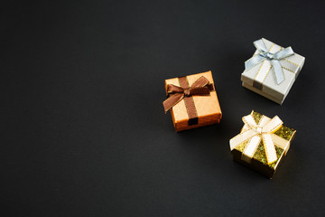 Gift boxes on a black background, top view
