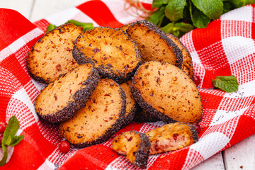 Cranberry cookies on red checkered towel. Close up