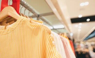 Looking for brightly colored clothes on hangers, Choose to buy clothes, clothes on hangers.
