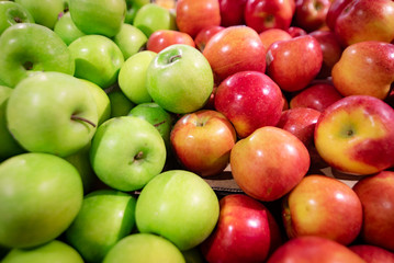 Green and red apples background. Eat apples for good health.