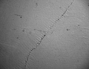 Crack in an old dirty wall