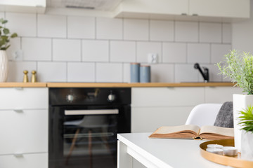 White kitchen with black oven