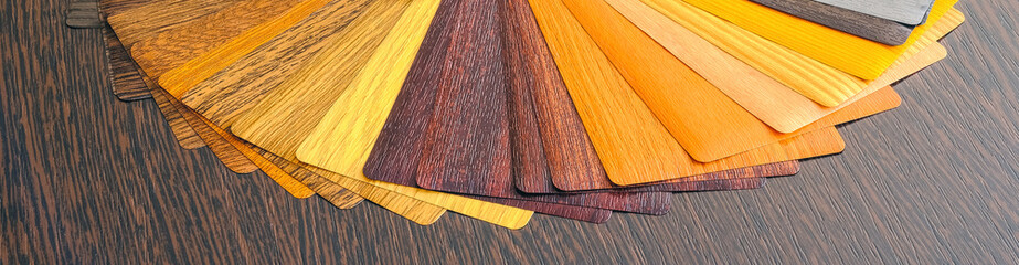Lamination samples. On a wooden background for lamination of any wooden and plastic products used...