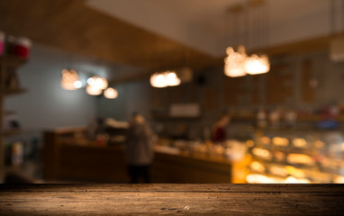 blurred background of bar and dark brown desk space of retro wood