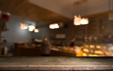 blurred background of bar and dark brown desk space of retro wood