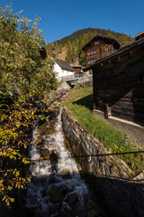 Fototapeta na wymiar Wooden houses in Ritzingen, Walliserhaus, mountain farm