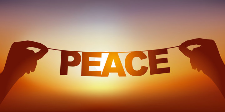 Concept de la paix et la tranquillité, avec deux mains qui tiennent une guirlande sur laquelle est écrit le mot paix, devant un ciel ensoleillé.